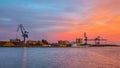 Massive cranes during sunset