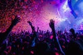 A massive crowd of people at a concert, celebrating with confetti-filled air, A confetti storm during a music concert, AI