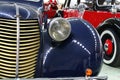 Massive front grille, mudguard and headlight of veteran Czechoslovak car Aero 30 from year 1939, deep blue colour