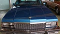 Massive front mask and twin square headlights of american luxury car Cadillac Eldorado, ninth generation from year 1978