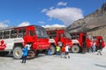 Massive Ice Explorers, specially designed for glacial travel, take tourists onto the surface of the Columbia Icefields, Canada Royalty Free Stock Photo