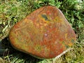 Red, yellow and ocher colored jasper on basalt Royalty Free Stock Photo