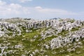 Massive layered limestone cliffs in mountain