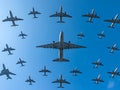 Massive military transport planes flying in a precise formation Royalty Free Stock Photo
