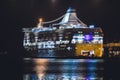 Massive passenger ferry tourist cruise boat in port, night view, sailing in Baltic sea, Helsinki, Finland Royalty Free Stock Photo