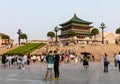 Massive people in sunken park by the historical and ancient Bell Tower of Xi\'an