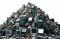 Massive pile of old electronics and computer parts forms a mountain of e-waste. Discarded monitors, circuit boards, and cables Royalty Free Stock Photo