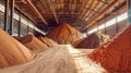 A massive pile of sand sits in a factory, ready for use in the mining and processing of potash fertilizers