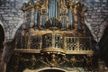 Massive pipe organ with golden ornaments at a church in Portugal Royalty Free Stock Photo