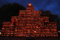 A massive pumpkin display is illuminated at night