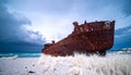 Rusty Shipwreck on a Stormy Beach Royalty Free Stock Photo