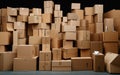 Massive stack of many cardboard boxed piled up together against a black background Royalty Free Stock Photo