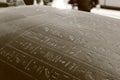 Hermitage Museum. Hieroglyphs on an ancient Egyptian sarcophagus, close-up. Black and white photo, sepia