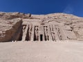 Massive stone statues at the entrance of Abu Simbel Temple. Egypt. Royalty Free Stock Photo