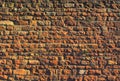 Massive stone wall with brown, orange, yellow colors Royalty Free Stock Photo