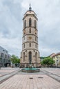 Massive tower of the town church in Balingen and the market fountain well, Germany