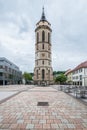 Massive tower of the town church in Balingen and the market fountain well, Germany