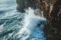 A massive wave forcefully collides with the side of a steep cliff, sending water surging upwards, Waves breaking against an ocean