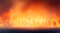 A massive wildfire engulfs a forest, with flames towering over the trees Royalty Free Stock Photo