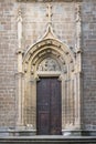 Massive wooden door with an iron lock in the architecture of Medieval Europe Royalty Free Stock Photo