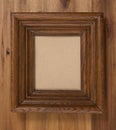 Massive wooden frame, dark brown square wood border on a dark board background and cardboard inside