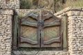 Massive wooden gate with large hinged iron lock in the village Royalty Free Stock Photo