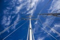 Mast in cloudy sunny day, with sails, summer time. Royalty Free Stock Photo