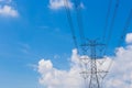 Mast electrical power line against cloud and blue sky background Royalty Free Stock Photo