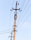 Mast electrical power line against cloud and blue sky Royalty Free Stock Photo