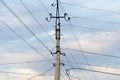 Mast electrical power line against cloud and blue sky