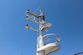 The mast of a large ship with navigation equipment bottom view. signal lights, and equipment.