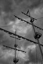 The mast of an old sailboat against the background of clouds of a stormy sky Royalty Free Stock Photo