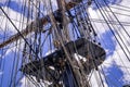 Mast, rigging and folded sails of a classic sailing ship. Royalty Free Stock Photo