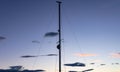 Mast of a sailing boat at sunset, wallpaper and copy space. Royalty Free Stock Photo