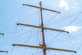 The mast with the sails against the blue sky