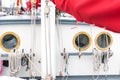 Mast, sails and window or porthole on a tall ship Royalty Free Stock Photo