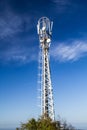 Mast is to accommodate cellular antennas on blue sky background Royalty Free Stock Photo
