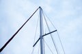 Mast of a white sailing yacht against the blue sky, copy space Royalty Free Stock Photo