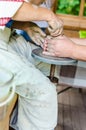 Master and apprentice learning clay crafting, potter and woman hands