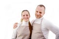 master and apprentice on two people beige kitchen or technical aprons sincere smile warm relationship joy advertisement Royalty Free Stock Photo