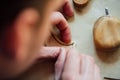 Master artisan luthier working on the creation of a violin. painstaking detailed work on wood. Royalty Free Stock Photo