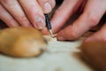 Master artisan luthier working on the creation of a violin. painstaking detailed work on wood. Royalty Free Stock Photo