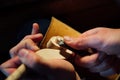 Master artisan luthier working on the creation of a violin. painstaking detailed work on wood.