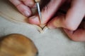 Master artisan luthier working on the creation of a violin. painstaking detailed work on wood. Royalty Free Stock Photo