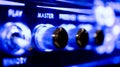 Master audio sound level knob detail on music amplifier blue neon light