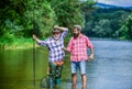 Master baiter. Fisherman with fishing rod. Activity and hobby. Fishing freshwater lake pond river. Bearded men catching Royalty Free Stock Photo