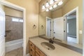 Master bathroom with light brown theme color and white doors Royalty Free Stock Photo