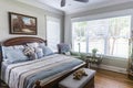 A master bedroom with a large picture window