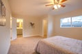 Master bedroom with open doors to bathroom, entry and closet Royalty Free Stock Photo