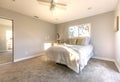 Master bedroom in San Diego model home with white golden light Royalty Free Stock Photo